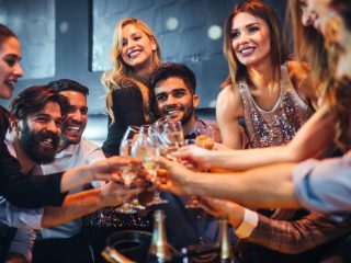 Friends drinking champagne in the club